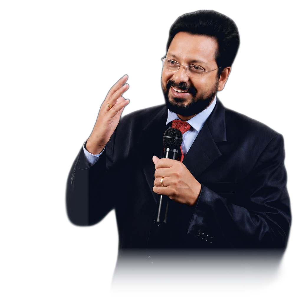 Saju Mathew speaking with a microphone